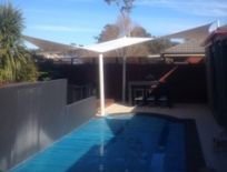 shades of blue shade sails swimming pool in house
